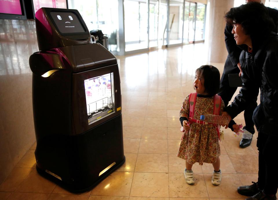 Panasonic's delivery robot, HOSPI, serve bottled beverages and provide bus information