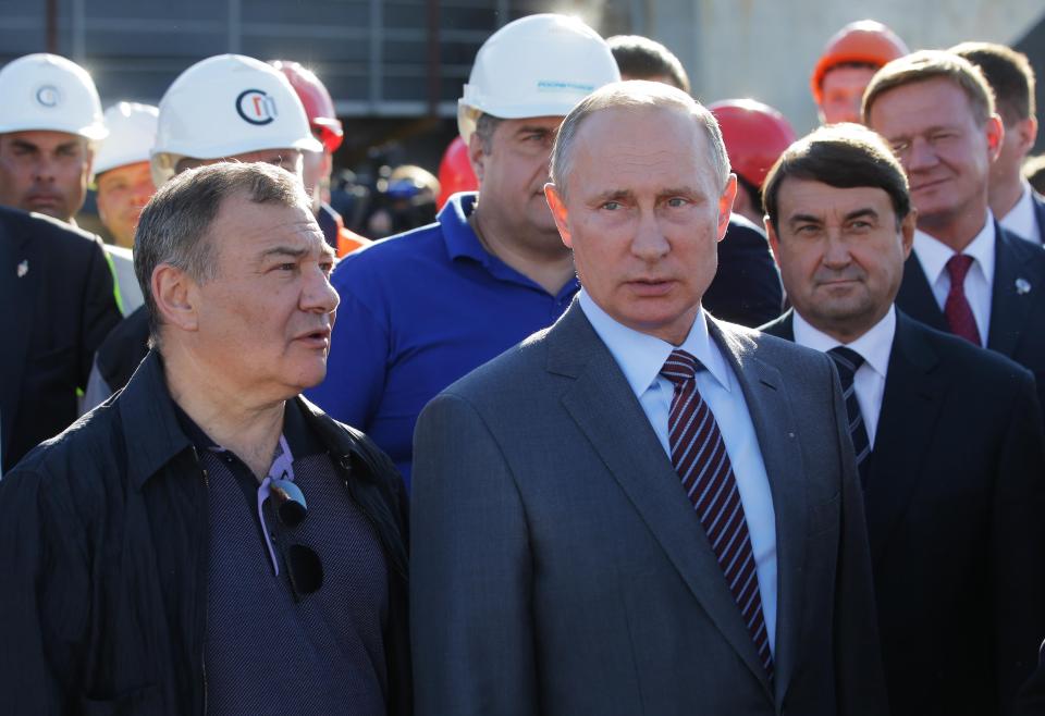 Putin has handed Arkady Rotenberg, left, a massive construction contract