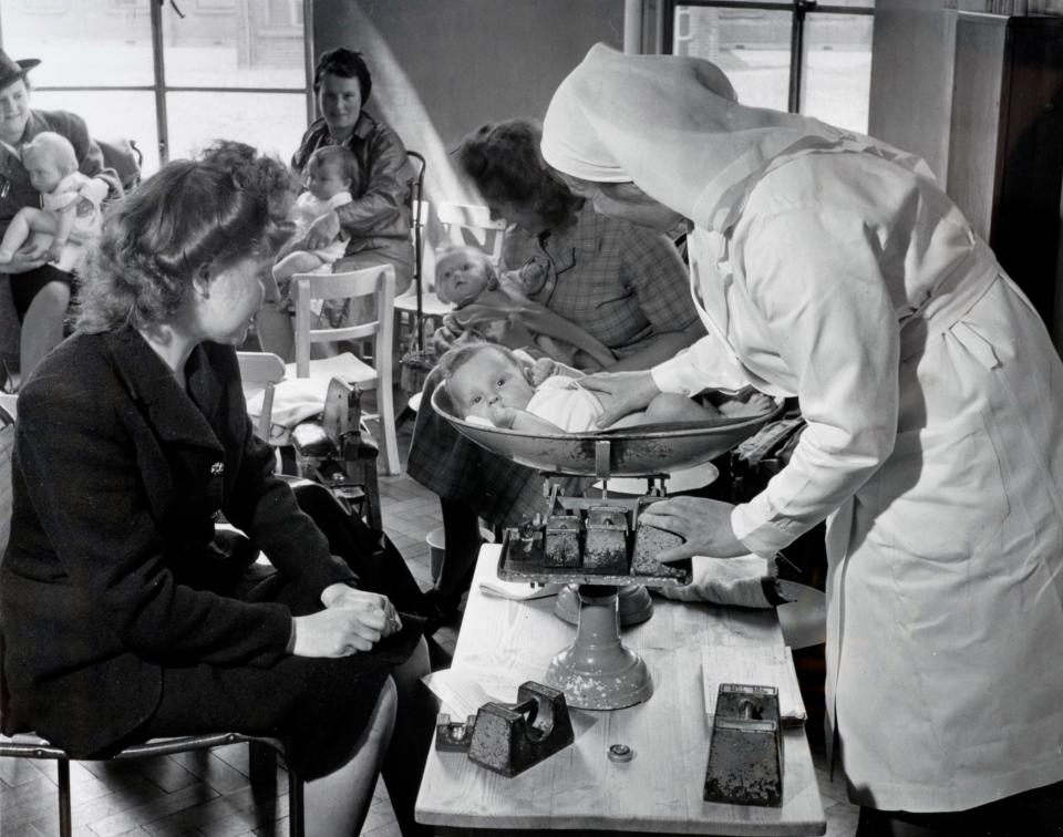  A newborn baby being weighed at a Bristol clinic in July 1948