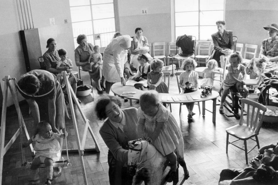 Children, mothers and nurses at a Bristol clinic where regular health checks were carried out