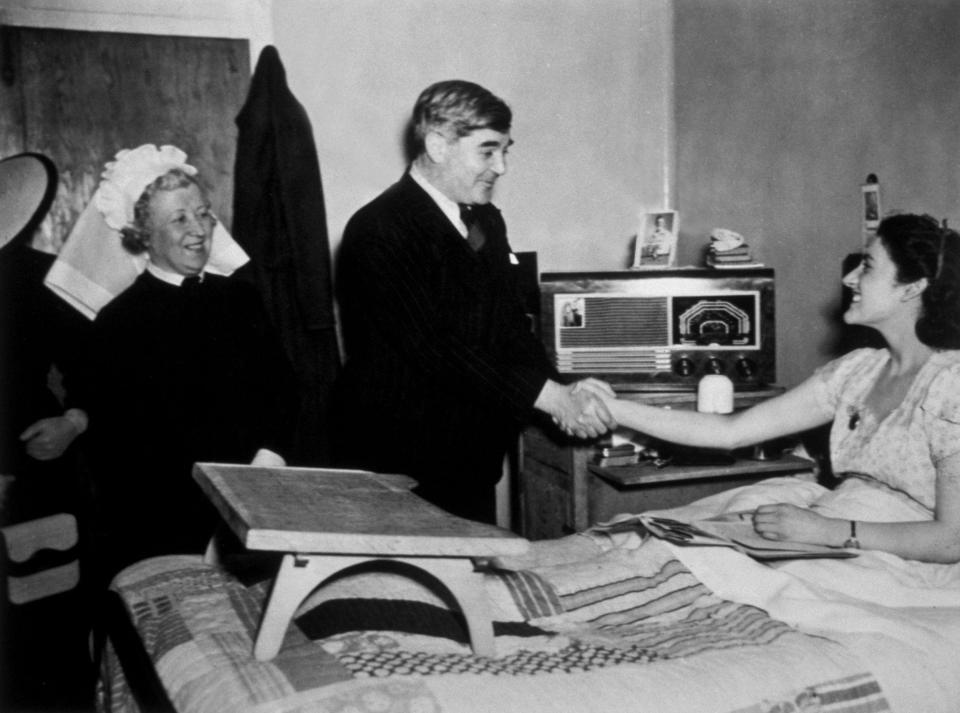 Aneurin Bevan, the Minister of Health, meeting a patient at Papworth Village Hospital. This centre for tubercular cases was taken over by the National Health Service on July 5, 1949