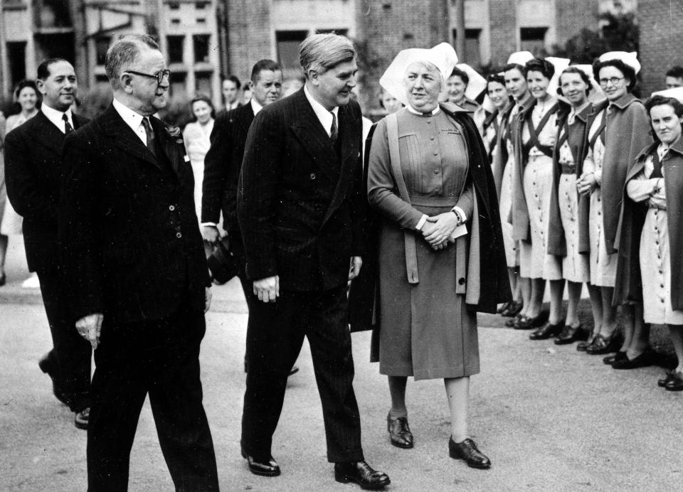 Welsh Labour politician Aneurin Bevan with a group of nurses on the day that the National Health Service came into being