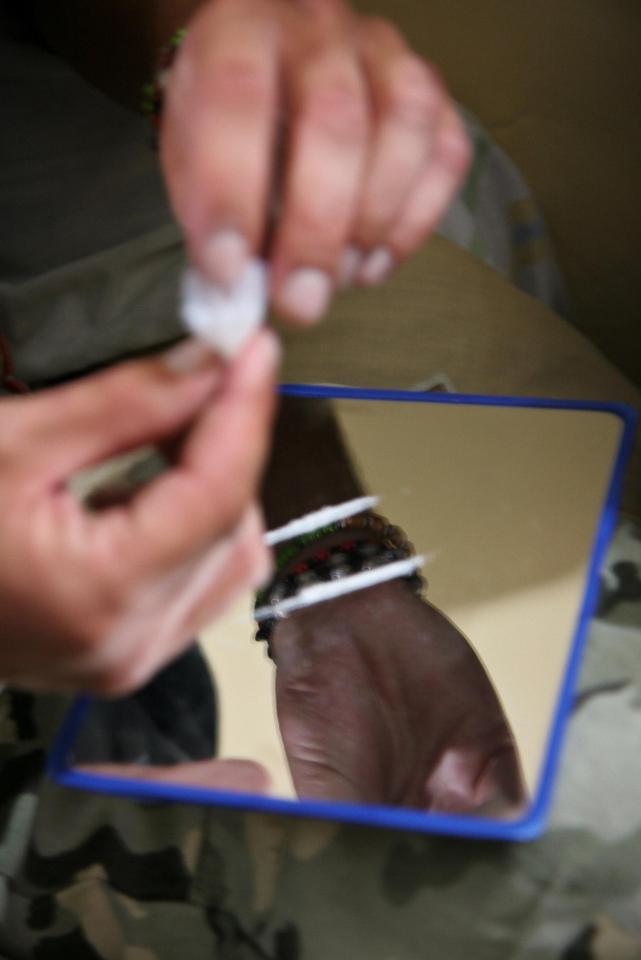 An inmate can be seen handling what looks like cocaine inside Bolivia's San Pedro Prison