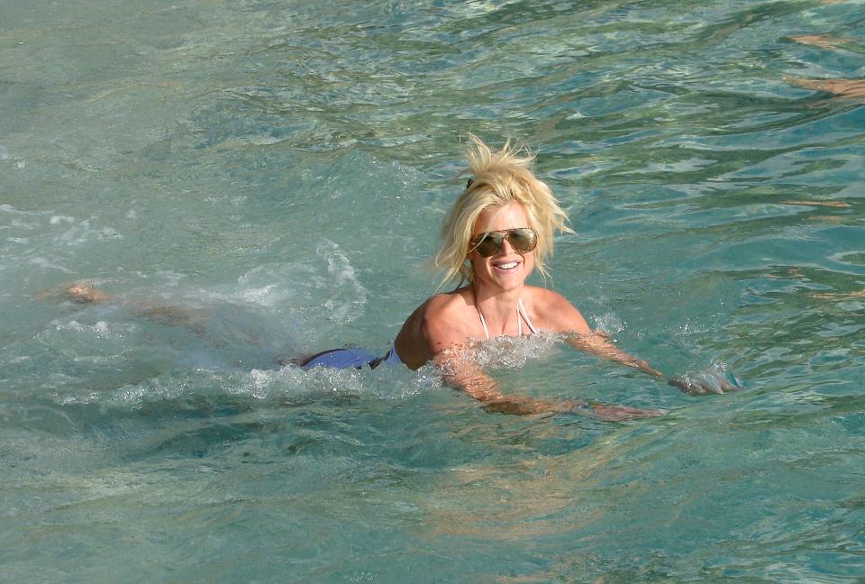  She smiled broadly as she enjoyed a swim in the warm water around St. Barts