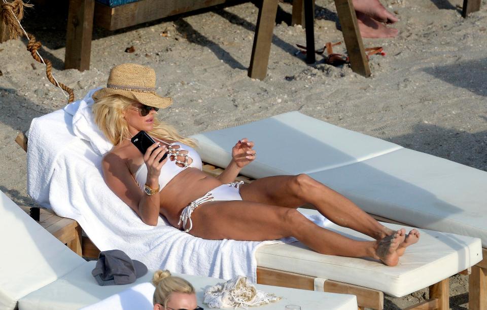  The former Playmate's tan was offset perfectly by the lounger and her outfit