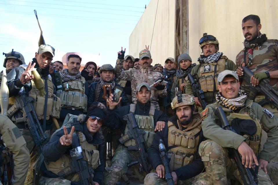  Iraqi counter-terror troops pose for the camera. The region was taken despite intense street fighting