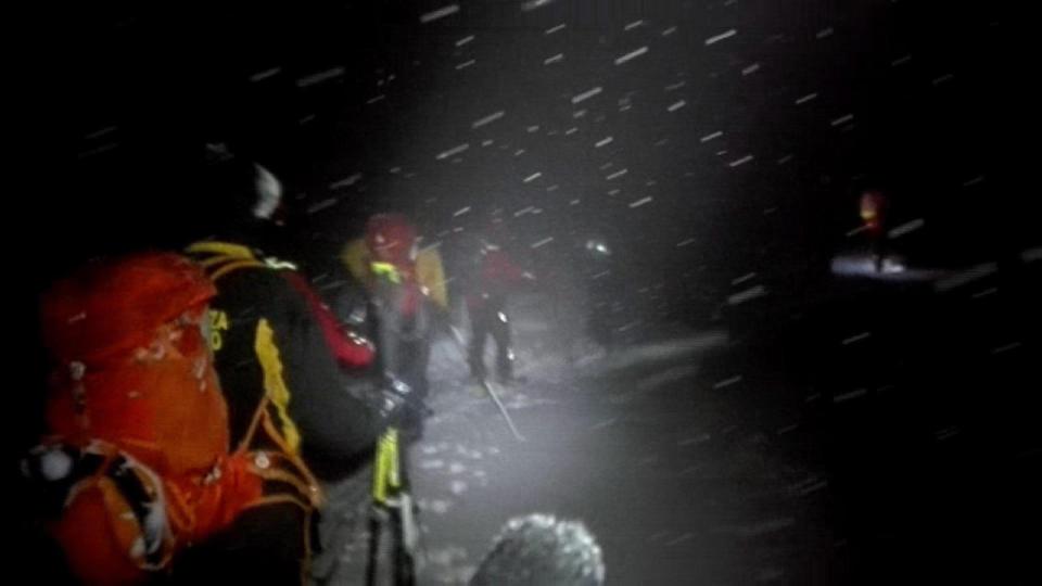  Rescue workers battle through a blizzard to reach the stricken hotel