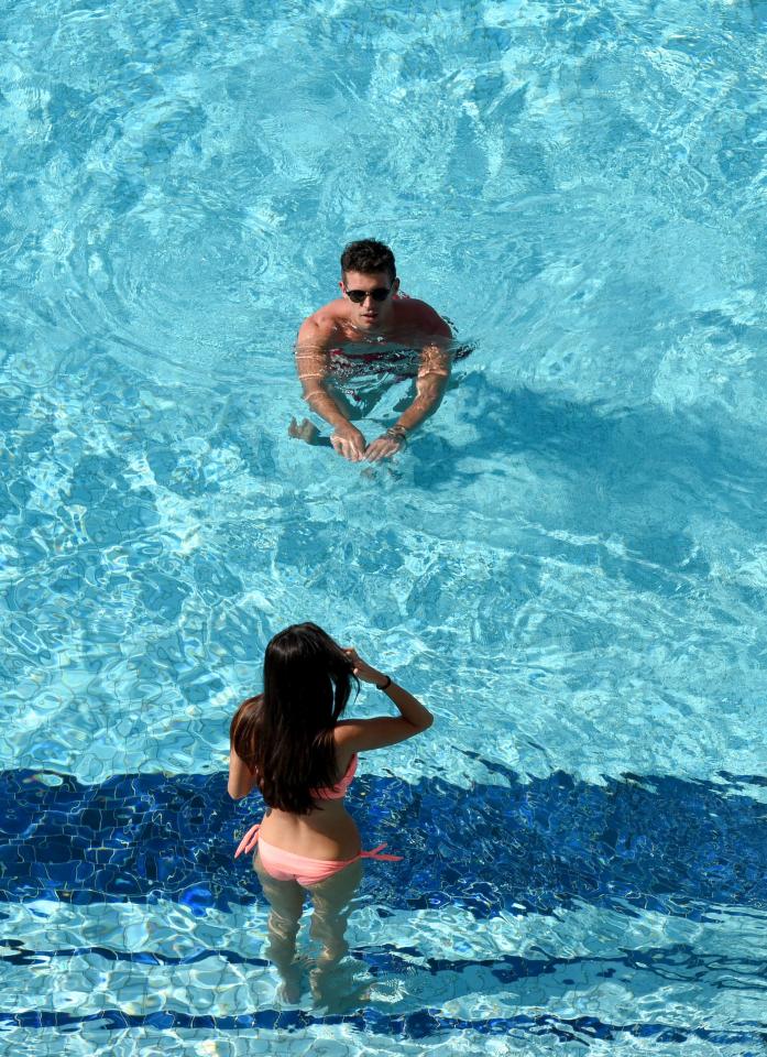  The pair later cooled off during a dip in the pool