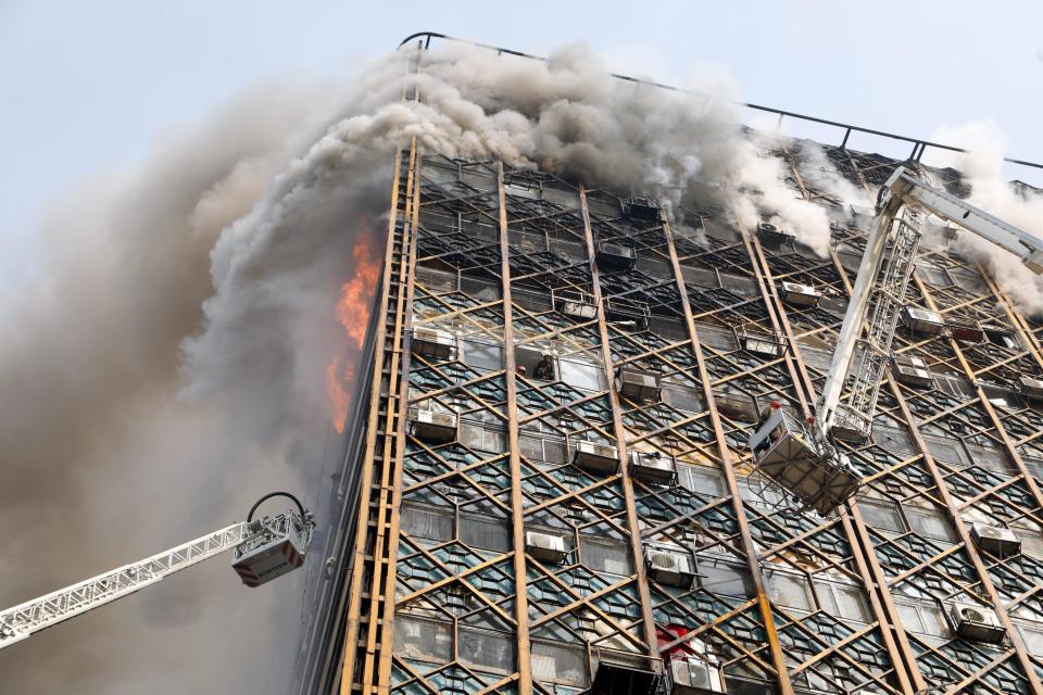  20 fireman are thought to have lost their lives in the blaze that struck Iran's oldest high rise building