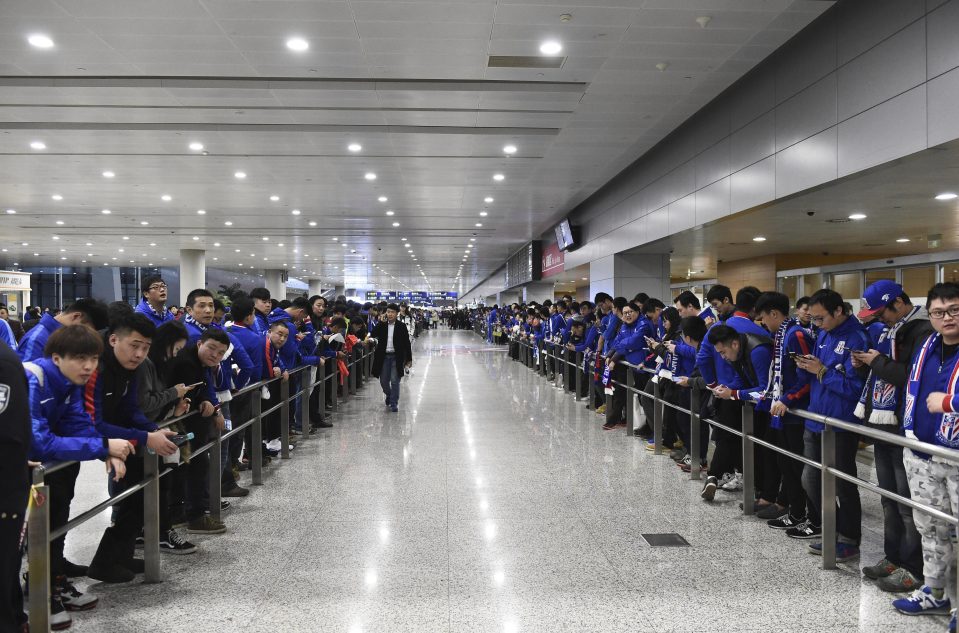  Carlos Tevez hardly cut a lonely figure on his arrival to join Shanghai Shenhua