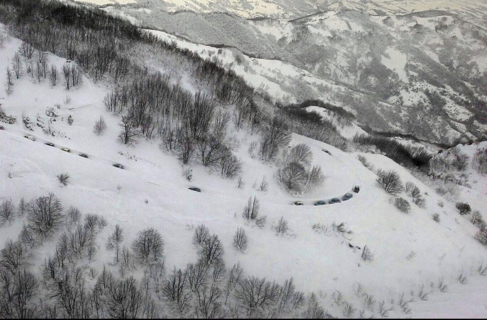  A rescue convoy makes its way through the snow to the hotel today