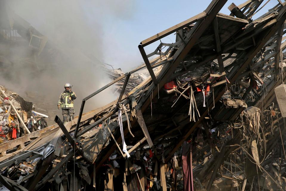  Firefighters, soldiers and other emergency responders dug through the rubble, looking for survivors