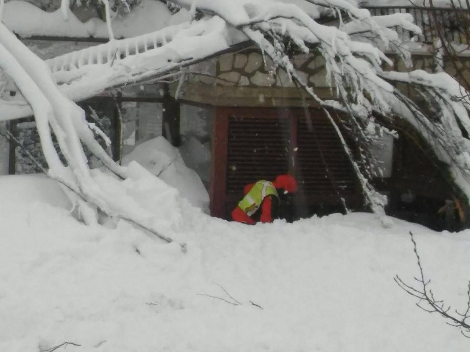  Rescuers arriving at the hotel try to access the building to search for survivors