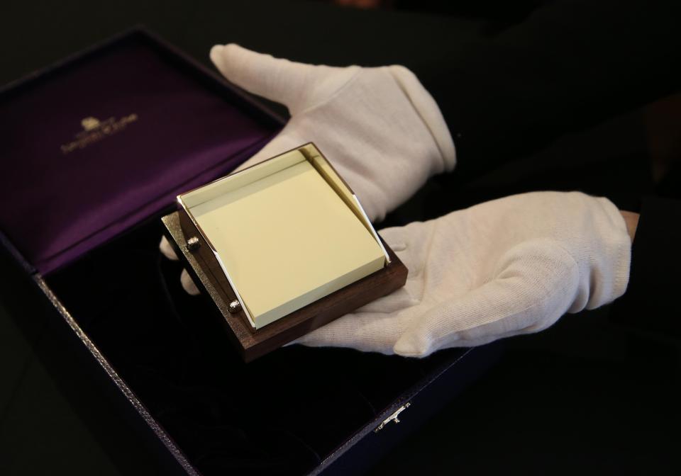  She also received a silver Post-it note holder on a leather base from an Edinburgh jewellers