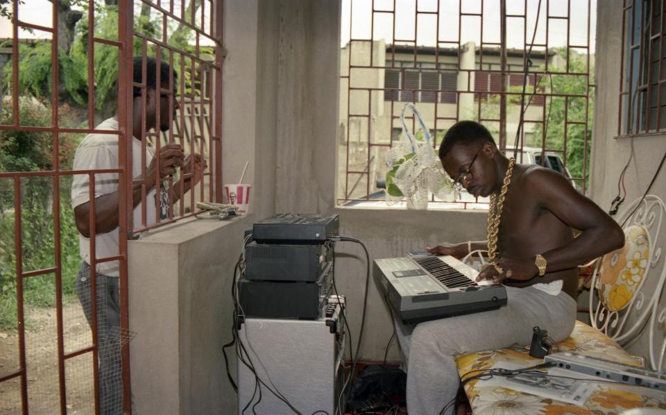  Deejay Tiger laying down his own computerised rhythms outside his home