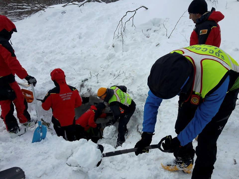  Members of Alpine and Speleological Rescue Team dig for survivors at the Hotel Rigopiano