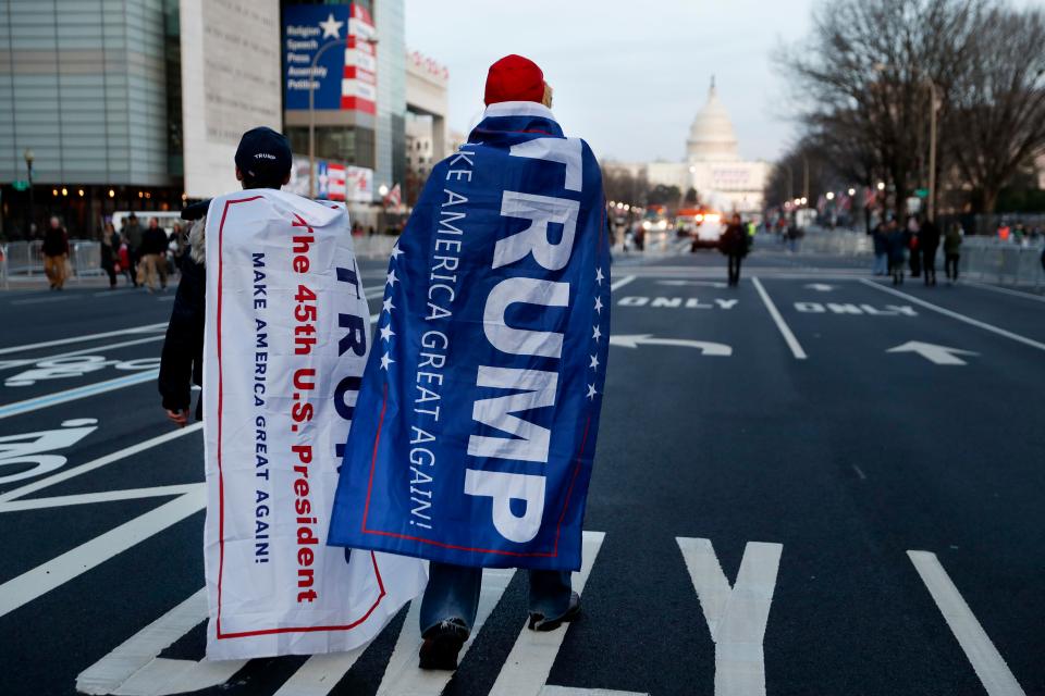  Trump supporters walk along Pennsylvania Avenue after it was closed to traffic