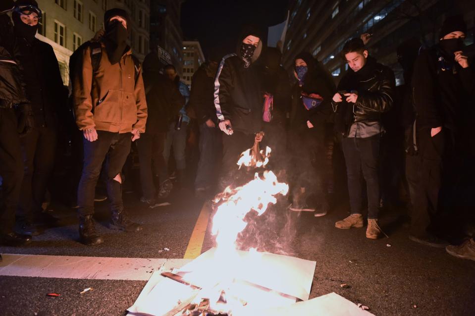  Activists burns posters outside the pro-Trump Deplorable ball in Washington DC