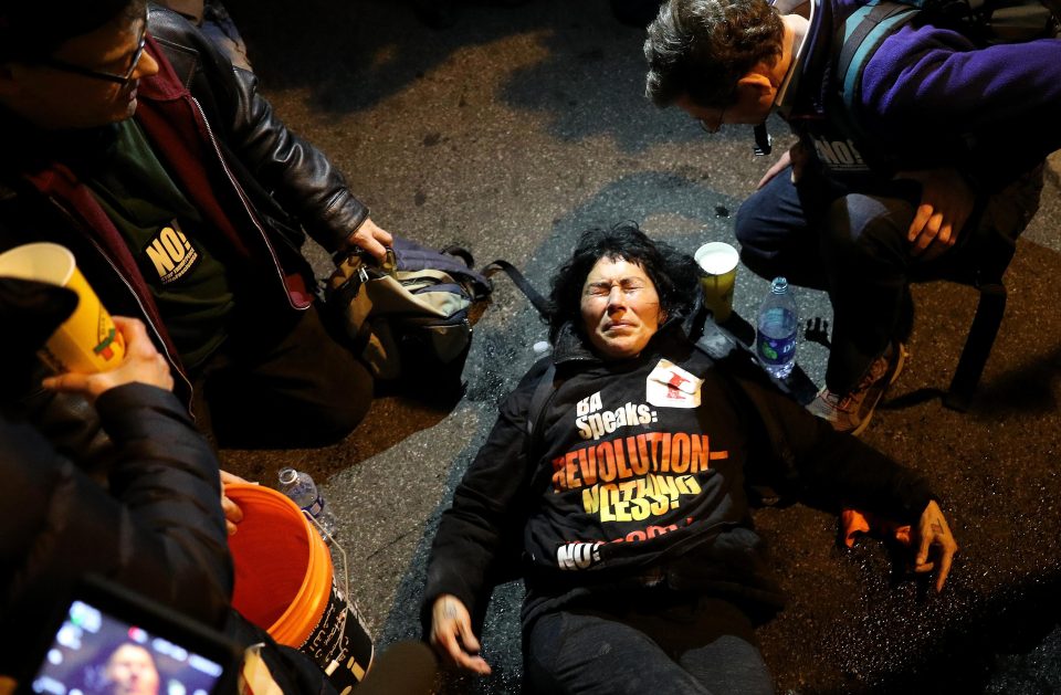  Another anti-Trump protester lies on the ground at the Washington demo