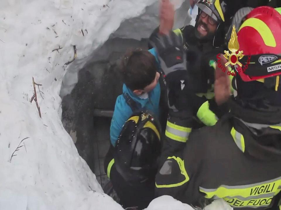  A surviving child was pulled from the snow after firefighters managed to dig down on Friday