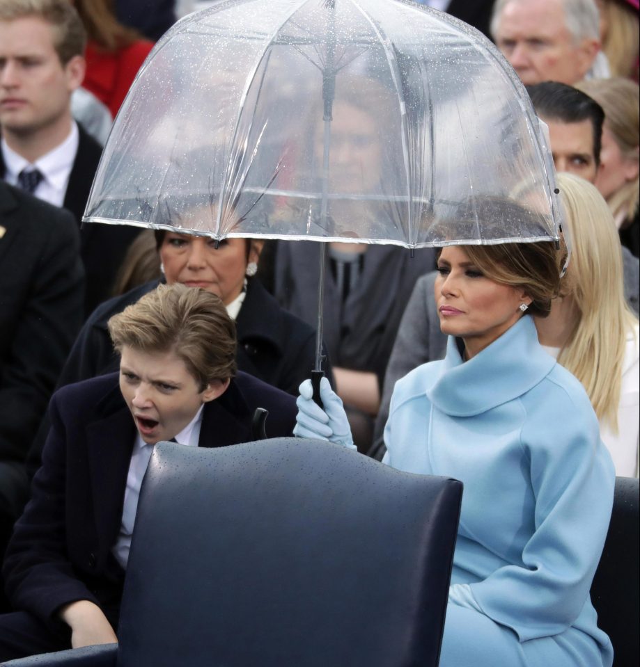  Barron was spotted yawning as he sat under his mums umbrella