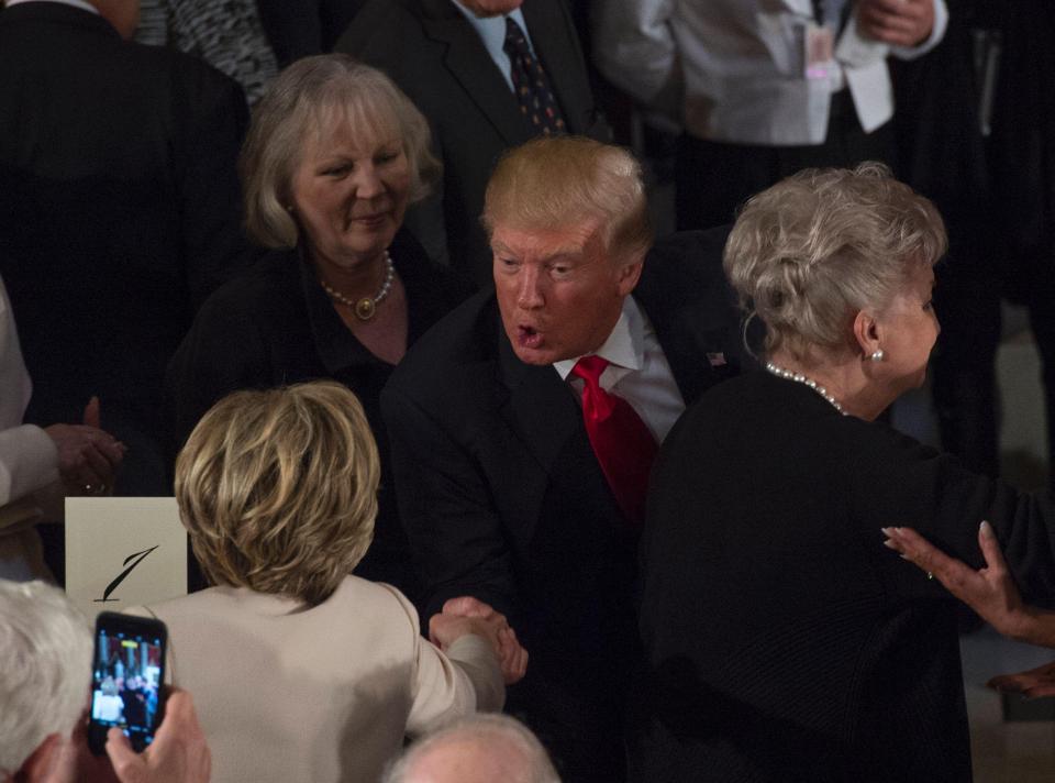  The new president attended a lunch after being sworn in and shared an awkward handshake with Hillary Clinton