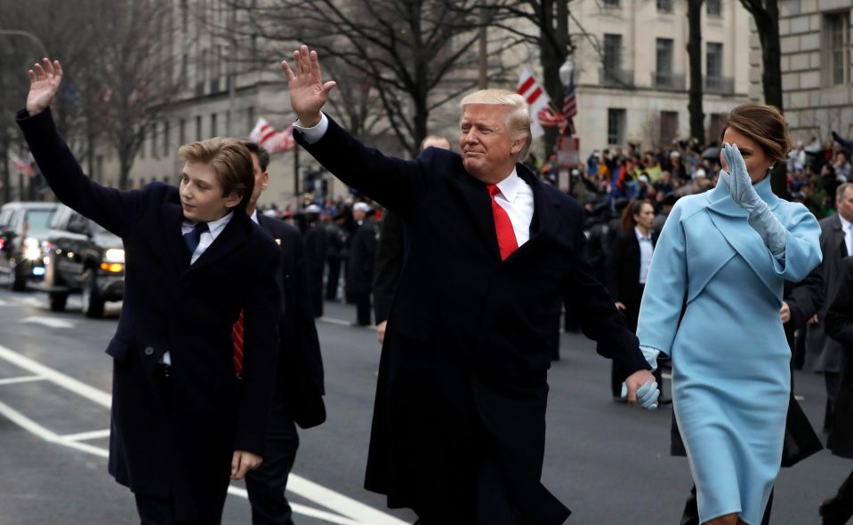  Donald Trump waved to spectators as he, wife Melania and son Barron headed up the parade