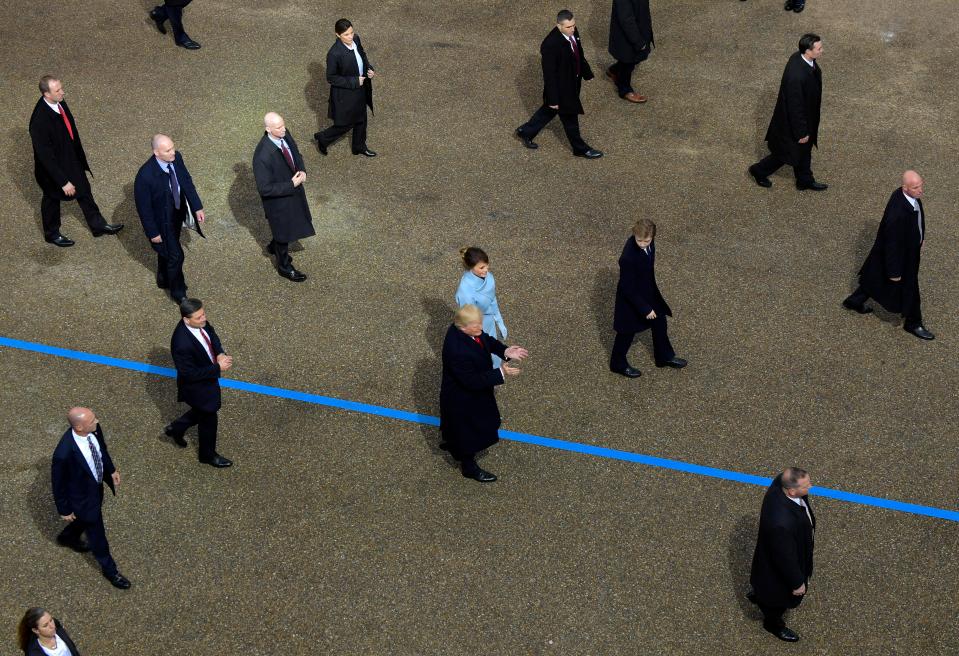  Trump and Melania walked slightly behind their 10-year-old son and surrounded by secret service agents and bodyguards