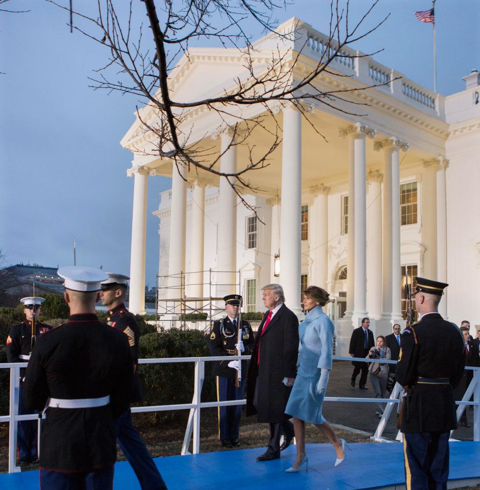  Donald and Melania Trump watch the Inaugural parade from outside the White House