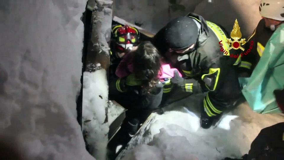  Moment a survivor is hauled from the rubble of the hotel in Italy