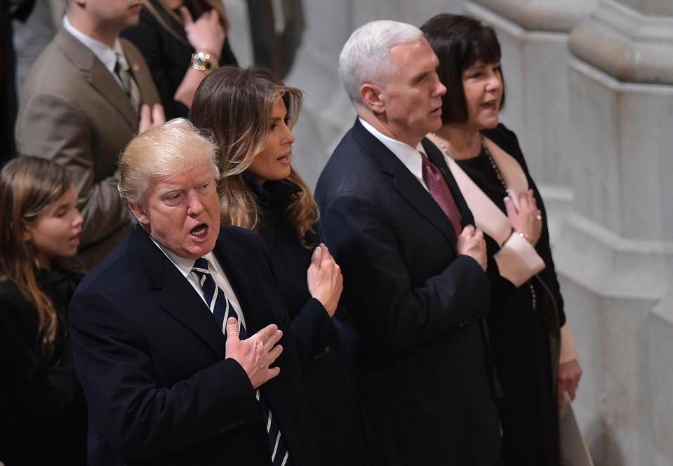  Trump covered his chest with his hand during the service