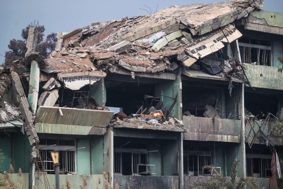  The sniper spotted his targets on the second floor of a war-torn building