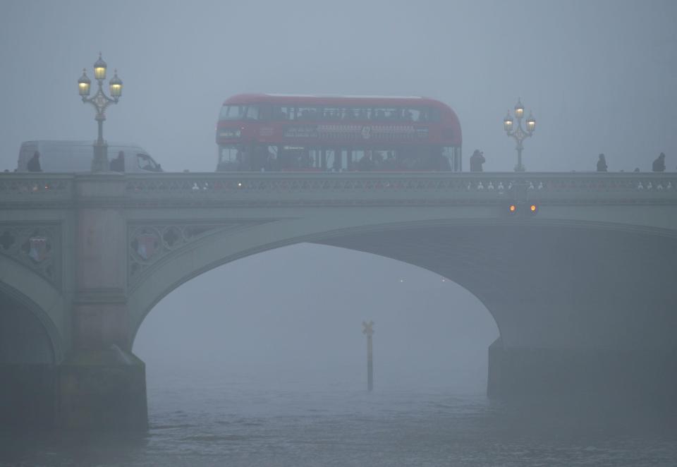  A bus makes it's way over Westminister Bridge in London this morning