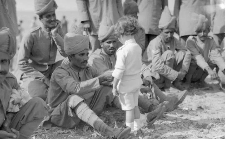  1914: A French boy introduces himself to Indian soldiers who had just arrived in France to fight alongside French and British forces, Marseilles