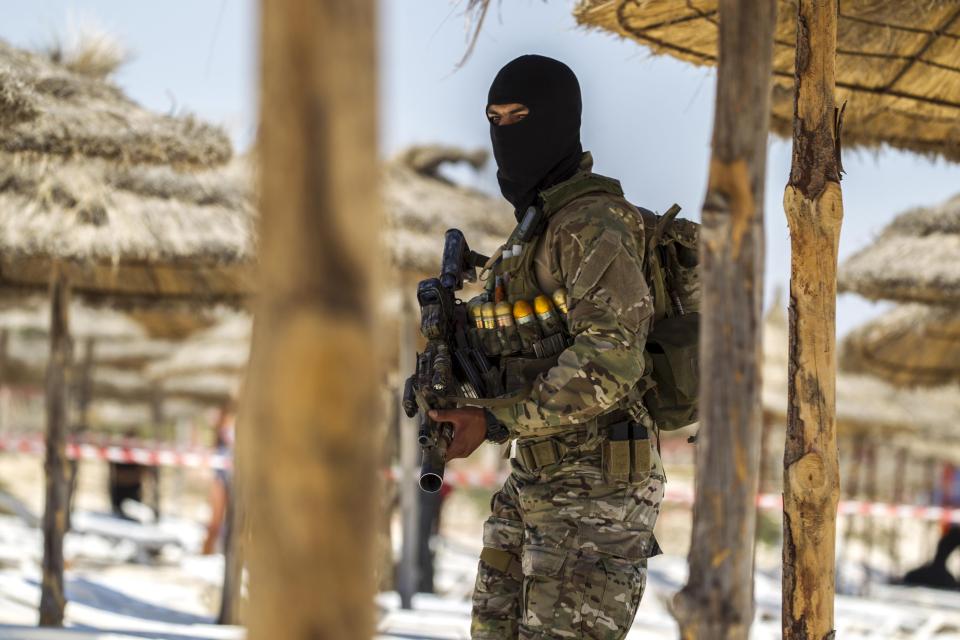  A member of Tunisia's special forces inspects the beachside of the Imperial Marhaba resort after the massacre