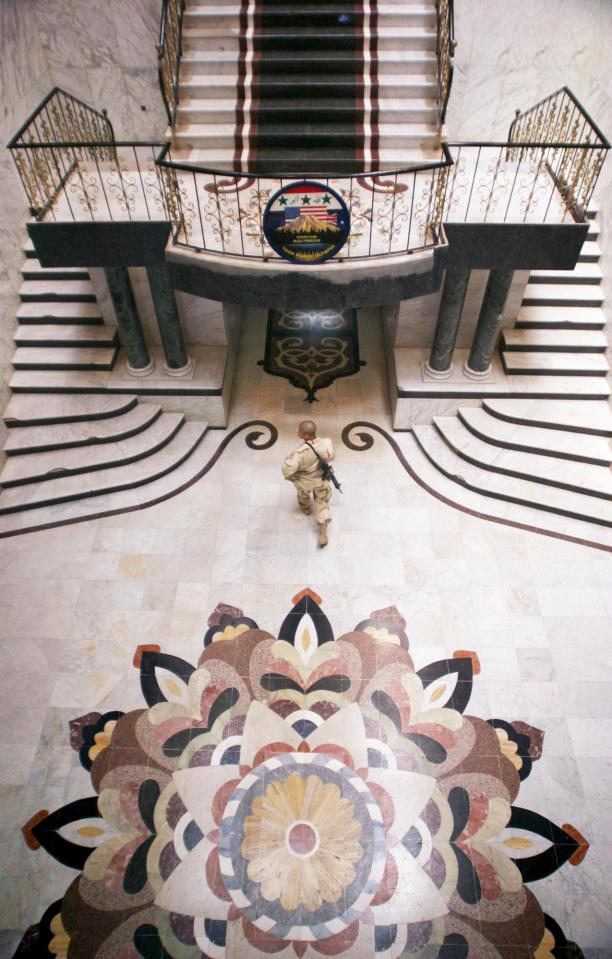  An American soldier in the hall way in the marbled Presidential Place