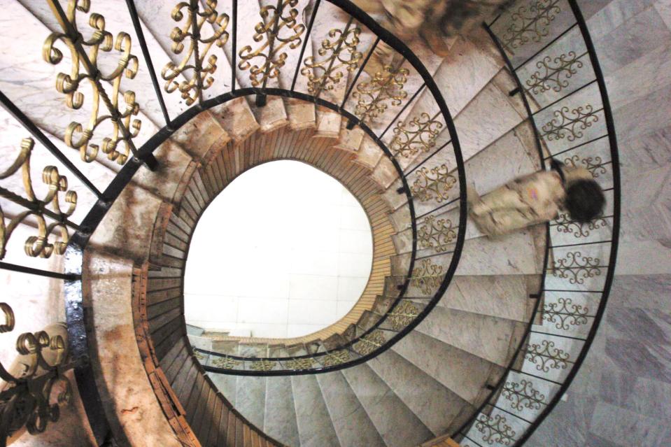  Capt. Marleen Lajoie of Augusta, right, descends a spiral staircase