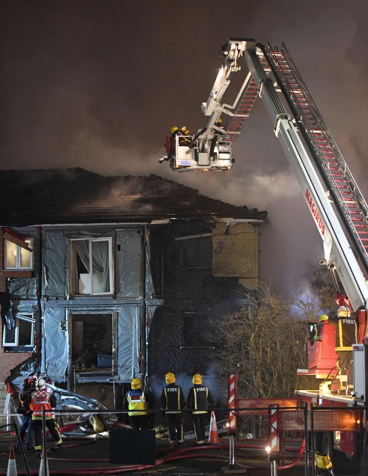  An eyewitness said the front of the flats had been 'blown out' across the road