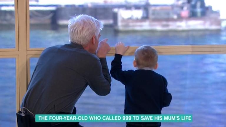  The presenter and Jacob watched the boats out the window