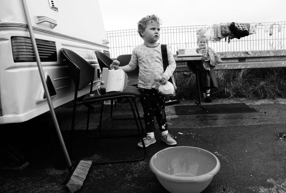  A small boy helps out with the cleaning up