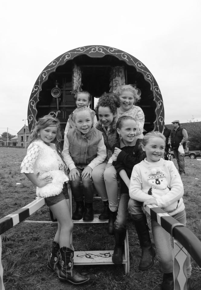  Kids pose outside a Romany caravan