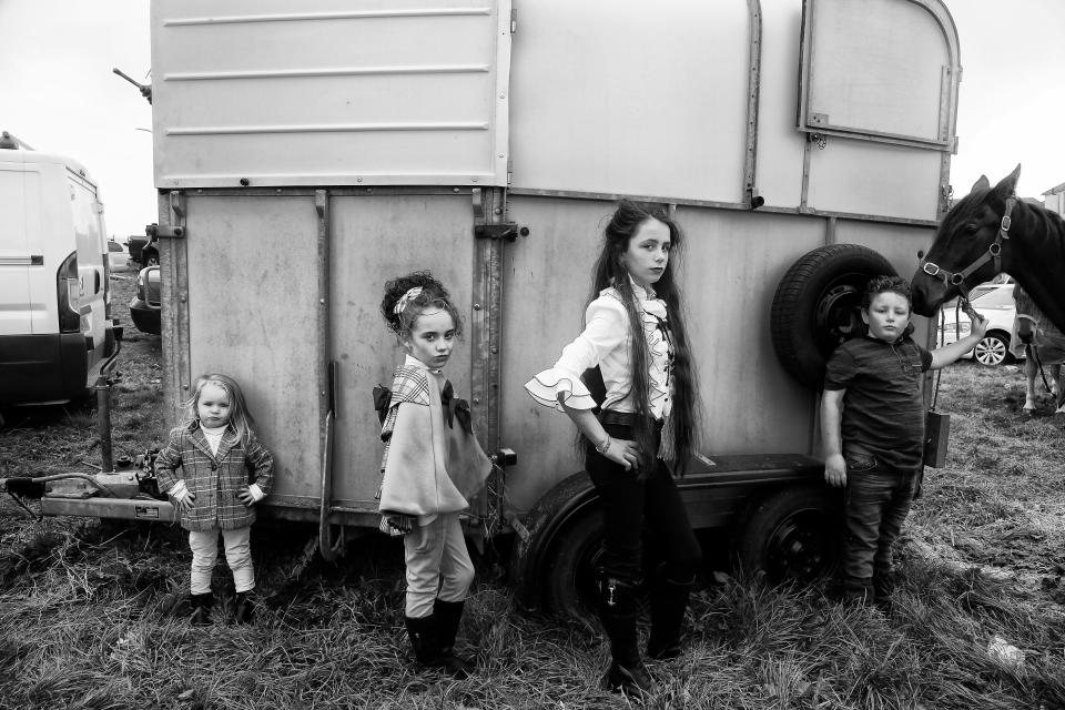  Kids are dressed up as they tend the horses at the fair