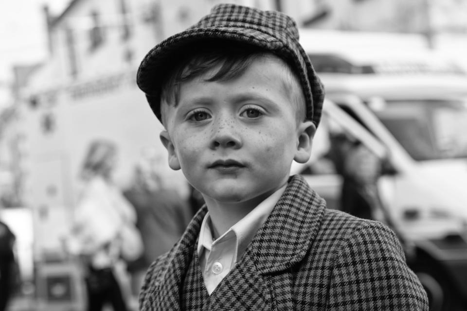  Wearing a flat cap and dapper suit this lad could have been snapped in the 1940s