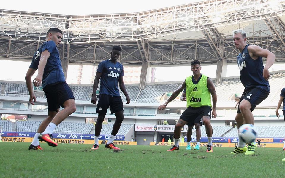 Axel Tuanzebe in training alongside some Manchester United first team stars