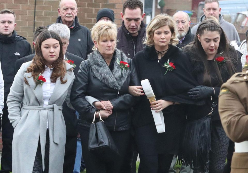  L/Cpl Hetherington's girlfriend Savannah Brown, left, walks arm in arm with his mother Anne who paid a moving tribute to her son today