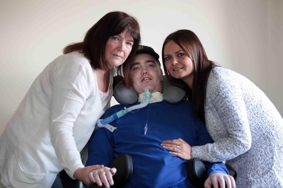  Tony is pictured with his mum Pepsi Cowan and partner Karen Dawson before he made the tough decision to switch the ventilator off