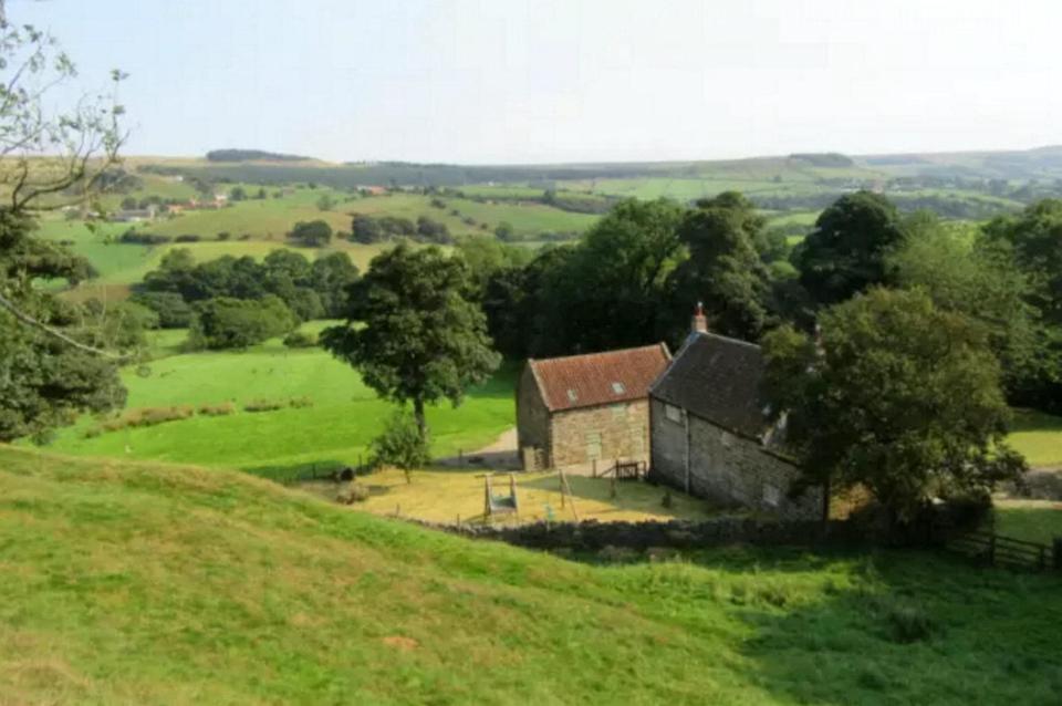  The farmhouse, pictured in 2017, is set in ten acres of woods and grassland