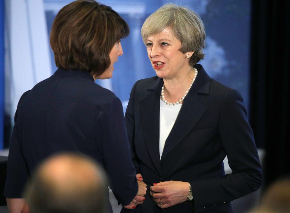  Theresa May speaks with an attendee during the Congress of Tomorrow