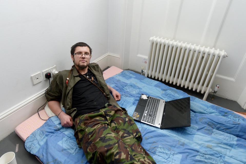  Squatter Jed takes a break from dismantling the capitalist machine as he stretches out on his bed in his new multi-million pound home