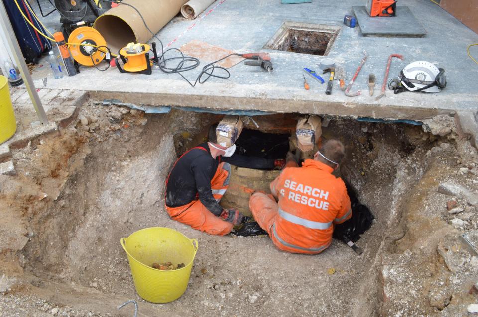  Picture showing the process of recovery of the body of Helen Bailey who was found in a cesspit deep below her home